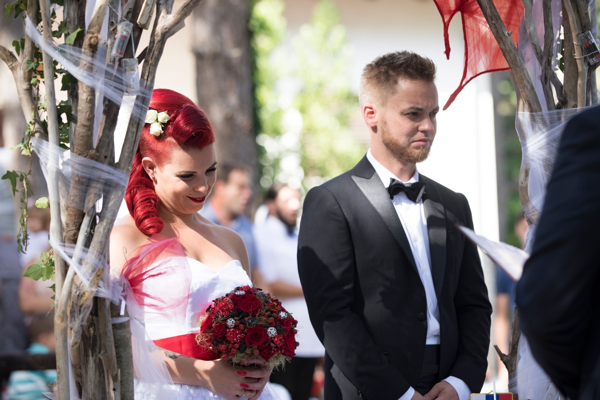 Bride and Bridegroom Listening To Marriage Officiant at Wedding Ceremony
